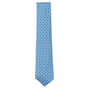 The Atomic Diamond Tie by Robert Jensen is a light blue silk tie with a dark blue geometric pattern and hand-stitched details, shown on a white background.