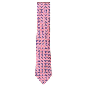 The Atomic Diamond Tie by Robert Jensen is a hand-stitched pink silk tie with a repeating geometric blue and red floral pattern, displayed on a white background.