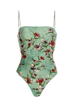 The Durazno Embroidered One Piece by Agua By Aguabendita is a mint green swimsuit with thin straps, made from recycled polyester, and features red, purple, and green floral embroidery.
