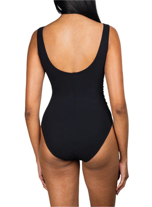A person is shown from the back wearing the Karla Colletto Basics V-Neck Tank with High Back One Piece swimsuit in black, set against a white background.