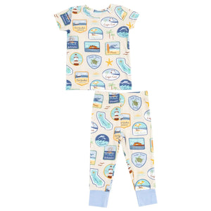The Angel Dear Baby and Kid's Short Sleeve Loungewear Set features colorful travel prints, light blue cuffs, and snug-fitting design for comfort and safety.