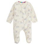 The Magnetic Me Baby Modal Footie is a cream, long-sleeve onesie made from eco-friendly TENCEL™ modal, featuring a subtle animal and tree print, snap buttons, and covered feet.