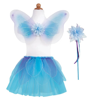 The Great Pretenders Fancy Flutter Skirt, Wings & Wand set on a mannequin, showcasing child-sized blue and purple wings with glitter petals, a flower motif, a matching tutu with an elastic waist, and a wand adorned with flower and ribbon details.