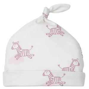 The Kissy Kissy Baby Love Dreamy Zebras Printed Hat is a white baby hat crafted in soft Pima cotton, featuring pink dreamy zebras and a charming top knot.