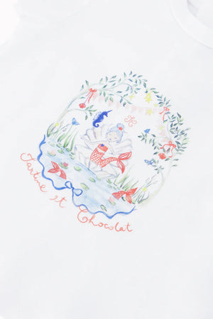 The Baby Girls' and Girls' Mermaid Graphic Tee by Tartine et Chocolat features puffy sleeves and a vibrant design of a girl by a pond with fish, plants, and a butterfly — the perfect summer treasure.