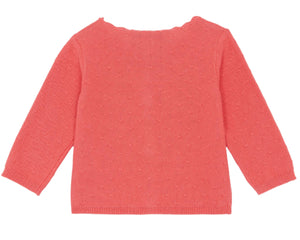 The Tartine et Chocolat Baby Girls' Pointelle Cardigan in coral is beautifully displayed flat, featuring long sleeves, a subtle dotted pattern, and scalloped edges that highlight the intricate craftsmanship.