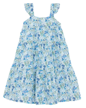 The Tartine et Chocolat Girls' Floral Dress is the perfect summer look with its sleeveless, tiered design, blue floral patterns on a white background, and charming ruffled shoulder straps.