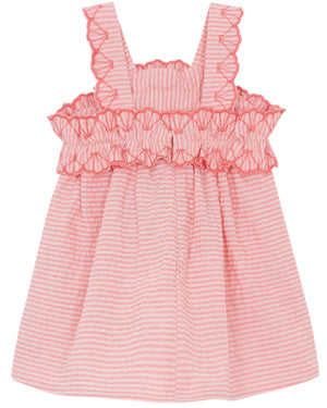 Tartine et Chocolat's Baby Girl's and Girls' Coral Seersucker Dress features a pink sleeveless design, red ruffled trim, and coral vertical stripes.