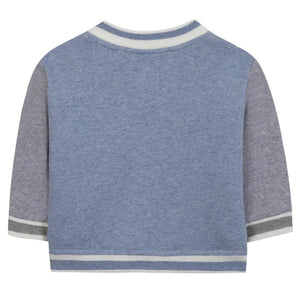 Back view of Tartine et Chocolat's Baby Boys' and Boys' Easy Bomber Cardigan in blue and grey, featuring white trim on the collar, cuffs, and hem.