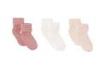 The Tartine et Chocolat Knit Sock 3-Pack features three pairs of cotton baby socks in pink, white, and light peach, each with ribbed cuffs—an essential addition to any nursery wardrobe.