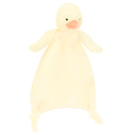 The Jellycat Bashful Duckling Comforter is a soft, pale yellow plush with a round head, orange beak, small wings, and knotted corners—crafted from recycled fibers—perfect as a newborn gift.