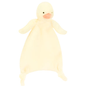 The Jellycat Bashful Duckling Comforter is a soft, pale yellow plush with a round head, orange beak, small wings, and knotted corners—crafted from recycled fibers—perfect as a newborn gift.