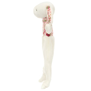 The Blossom Cream Bunny 'Berry' Comforter by Jellycat is a white plush rabbit with a floral-patterned body and long ears, shown upright in profile against a white background.