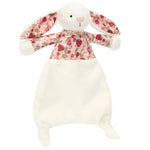 The Blossom Cream Bunny 'Berry' Comforter by Jellycat is a plush bunny with long ears, a white body, and floral-patterned shirt and ear lining with pink and red strawberries, crafted from soft recycled fibers.