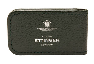 The Capra Magnetic Cash Clip by Ettinger is a luxurious green goat leather accessory with an embossed Ettinger London logo, featuring a discreet magnetic money clip for added elegance.