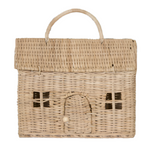 The Olli Ella Casa Clutch, Straw is a charming rectangular wicker basket crafted from natural rattan, designed to resemble a toy house with window details and an arched door. It includes a top handle for easy carrying.