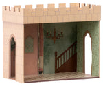 The Maileg Castle Hall is a cardboard room model with castle-like battlements, a staircase, chandelier illustration, and arched doorways for a grand royal adventure.