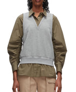 A person wears the 3.1 Phillip Lim Layered Vest Ruched Sleeve Shirt, styled with beige cargo pants.