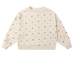 The Girls' Boxy Pullover by Rylee & Cru is a cream French terry sweatshirt featuring a comfy boxy fit and an allover print of small, multicolored hearts.