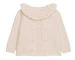The Louise Misha Baby Girls' Evina Sweater is a cream knit with a ruffled Pierrot collar, decorative front stitches, and cable knit sleeve details.