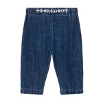 Louise Misha Baby Girls' Flofia Pants in dark blue denim with an elastic waistband and delicate white embroidery along the top, shown flat on a white background.