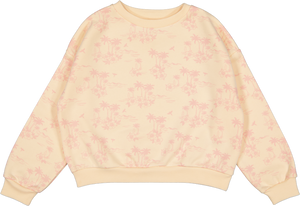 The Girls' Peace Sweat Shirt by Louis Louise is a cream-colored cotton sweatshirt with a subtle pink palm tree pattern, drop sleeves, and a ribbed crew neckline.