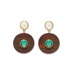 The Taj Disc Earrings by Lizzie Fortunato feature gold-plated brass, a white stud, a brown wooden circle, and a vivid green topaz centerpiece.