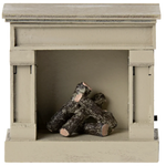 The Fireplace, Mouse - Off White by Maileg is a charming decorative fireplace featuring artificial logs and a vintage finish that enhances any space.