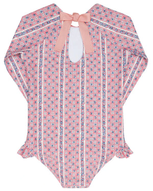 The Minnow Girls' Floral Tile Rashguard One Piece features long sleeves and a pink floral tile print—ideal as sun-safe swimwear or paired with your favorite girl's rashguard.