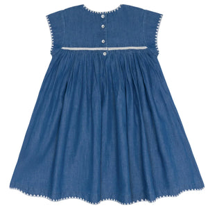 The Minnow Girl's Chambray Embroidered Cap Sleeve Dress features cap sleeves, white trim, three back buttons, and gathered detailing.