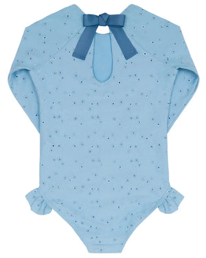 Minnow Girls' Eyelet Rashguard One Piece features light blue eyelet details, a back keyhole opening, ruffled sleeves and legs, hip ruffle accents, and a blue ribbon bow at the neckline.