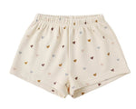 Rylee & Cru Girls' Track Short: comfy beige French terry shorts with an elastic waist and an all-over multicolored heart pattern.