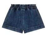 The Girls' Virgina Shorts by Louise Misha are dark blue denim with an elastic waist, side pockets, and a wide fit, shown against a white background.