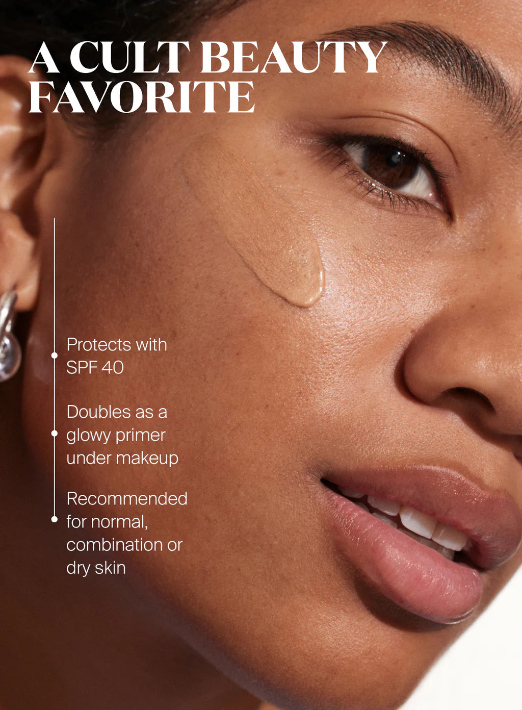 Close-up of a woman's face with a swatch of Supergoop Glowscreen SPF 40 in Golden Hour, highlighting SPF 40 protection, all-day hydration, and benefits for normal, combination, or dry skin.