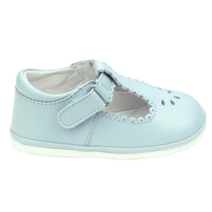 The L'Amour Shoes Girls' Dottie Scalloped Mary Jane is a light blue baby shoe with irresistible style, showcasing a scalloped trim, cut-out design, and a single strap secured by a buckle.