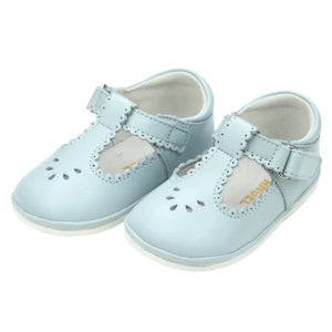 The Girls' Dottie Scalloped Mary Jane by L'Amour Shoes are light blue with a stylish T-strap, decorative perforations, velcro fasteners, and dainty scalloped trim on a white background.