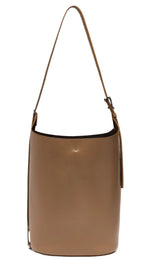 The Proenza Schouler Brant Bucket Bag boasts a versatile design with its tan calf leather, single strap, and minimalist style.