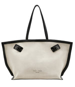 The Days Natural Linen Tote by Proenza Schouler is a spacious white linen carryall featuring black leather handles, trim, and base panel, accentuated with two sophisticated black buckles at the top.