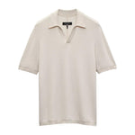 The Harvey Chevron Johnny Polo by Rag & Bone is a beige, short-sleeve knit shirt with a soft cotton blend, chevron textured pattern, and an open V-neck collar.