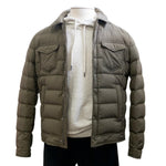 A Legend LA Denim Jacket from Herno, in olive green with button closure and down insulation, provides lightweight warmth over a grey hoodie on a mannequin against a plain white background.