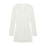 The Simkhai McCall Mini Dress is a long-sleeve white shift dress with textured crochet lace embroidery, a round neckline, scalloped edges, and a chic mini length.