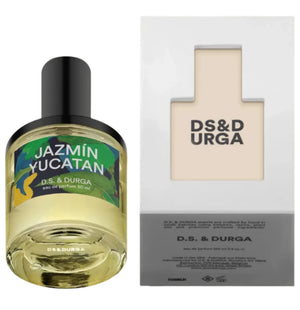 The D. S. & Durga Jazmin Yucatan 50ML perfume bottle is displayed next to its box, featuring the brand name and a cutout design that captures the allure of jazmín yucateco among ancient ruins.