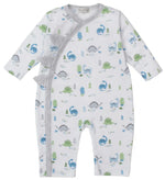 The Kissy Kissy Baby Boys' Dinosaur Era Playsuit features soft Pima cotton, a blue, green, and grey dinosaur print, gray striped trim, and playful fabric dinosaur spikes on the left shoulder and side.