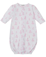The Kissy Kissy Baby' Giraffe Grace Convertible Gown is a white, long-sleeve infant gown made from soft Pima cotton with a pink giraffe print and an elasticized hem.