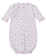 The Baby Girls' Ready to Dance Convertible Gown by Kissy Kissy features long sleeves, pink ruffle trim, an allover pink floral and umbrella print, front snaps, elasticized hem, and is made from soft Pima cotton.