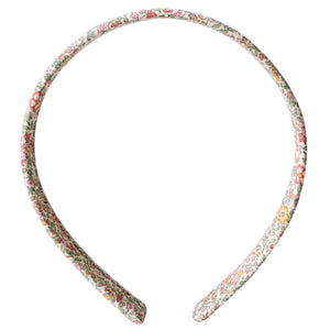 The Girls' Medium Plain Hairband by Milledeux showcases a vibrant floral design in Liberty Katie & Millie B fabric.