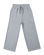 The Girls' Hailey Sweatpant by Rylee & Cru features a light gray wide-leg design with an elastic waistband, drawstring, side pockets, and a small white heart outline on the left thigh.