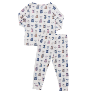 The Pink Chicken Kids' Bamboo PJ Set features long sleeves and a ballet shoe pattern in blue, pink, and purple on white. Made from soft bamboo for cozy nights, these pajamas combine style and comfort for bedtime.