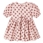 The Rylee & Cru Baby Girls' and Girls' Rose Dress features short sleeves, a gathered waist, and an all-over dark red floral print on light pink fabric.
