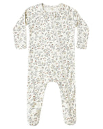 The Quincy Mae Baby Bamboo Zip Footie features a small floral print, long sleeves, covered feet, and a diagonal front zipper for cozy comfort.